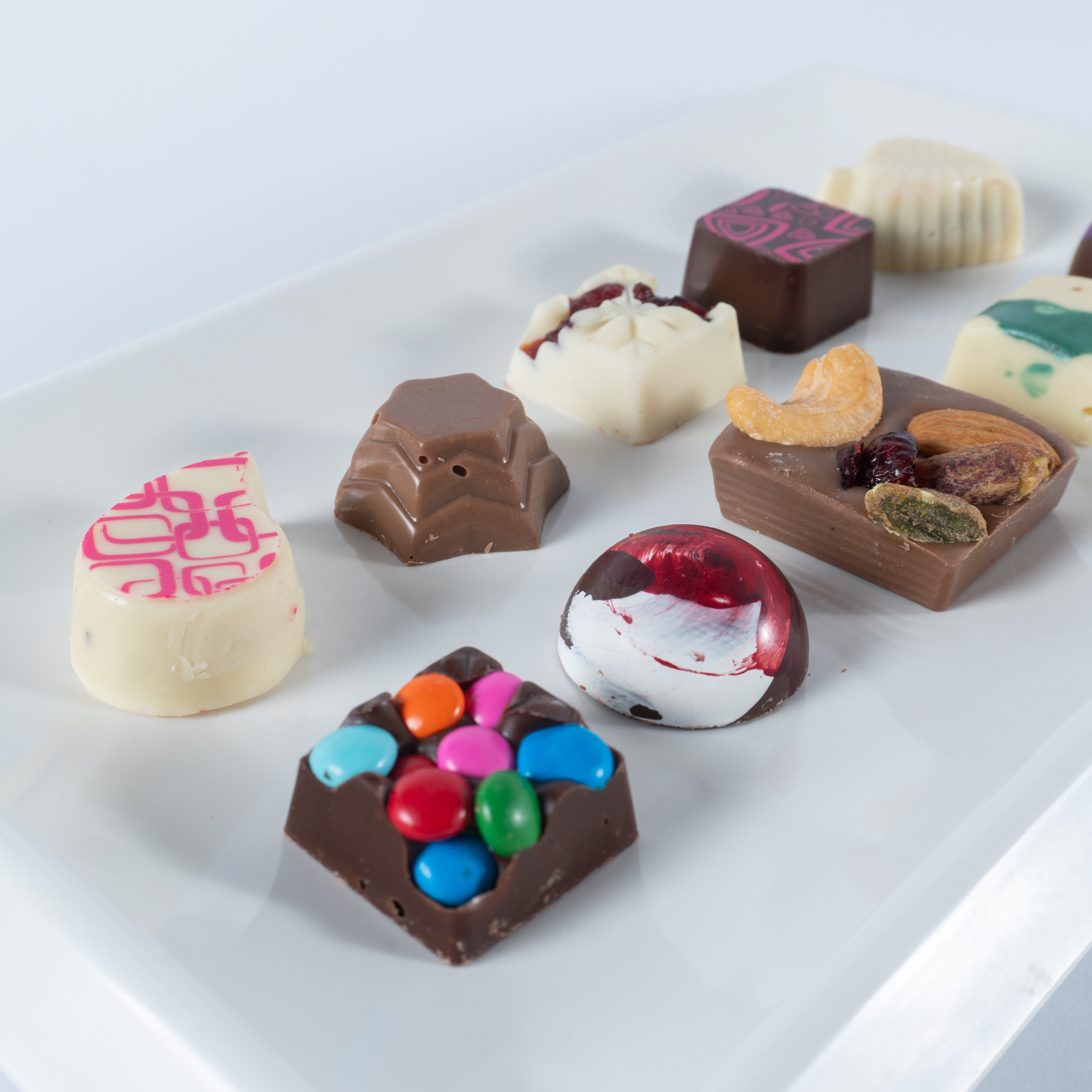 Paquete de 30, 50 ó 70 Carteritas de 9 chocolates